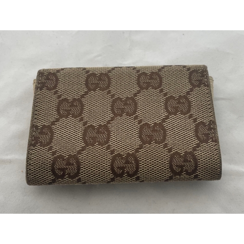 81 - Gucci Coin Purse