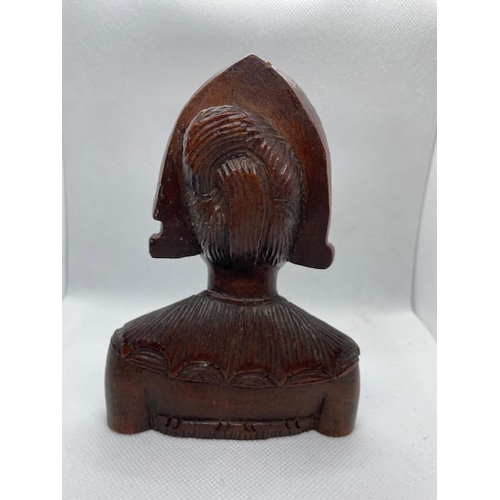 75 - A Balinese hand carved from Indonesian Acacia hardwood bust of Devi Sri Goddess