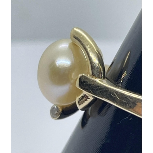 71 - 14ct pearl & diamond ring