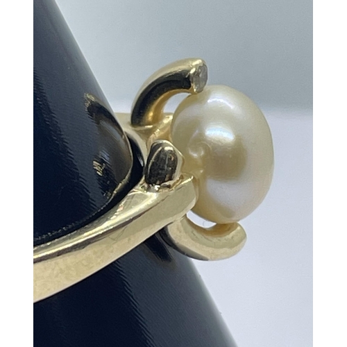 71 - 14ct pearl & diamond ring