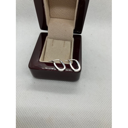 12 - 18ct white gold earrings
