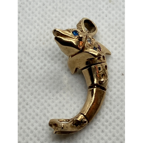 19 - 9ct gold Dolphin charm pendant with gems