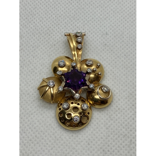 199 - 18ct diamond and amethyst designer pendant