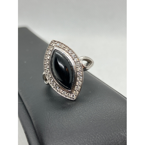 180 - 18ct white gold designer onyx and diamond ring