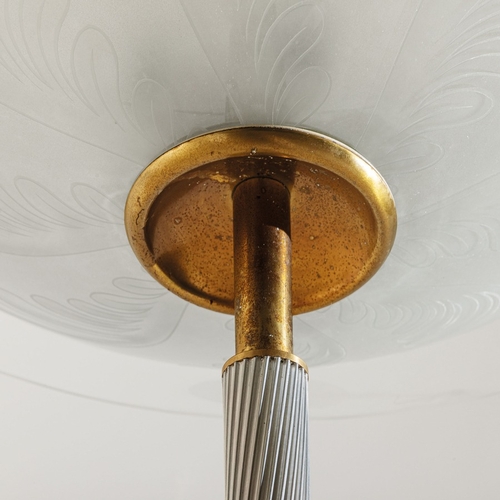 151 - PIETRO CHIESALampada da terra. Ghisa goffrata, alluminio lavorato, ottone, cristallo curvato, colora... 