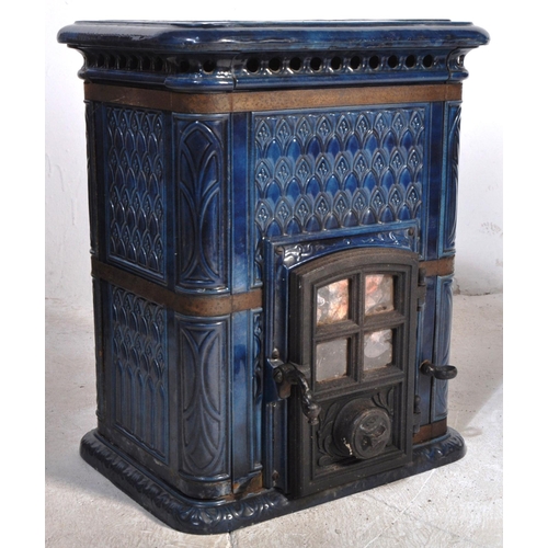 13 - An early 20th Century French cobalt blue enamel wood burner stove. Lattice top with classical decora... 
