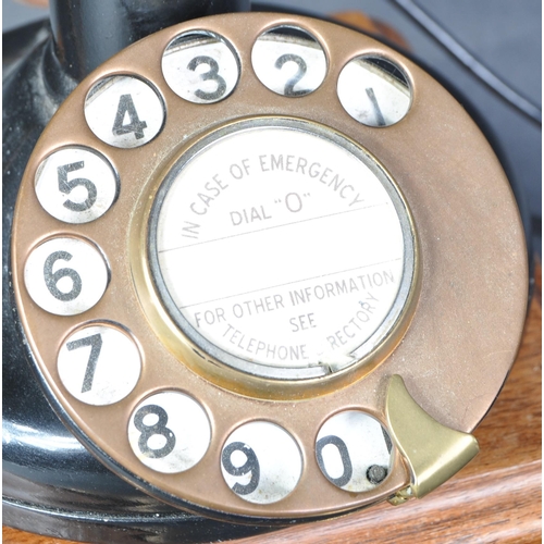 29 - GPO 150 No.2 - A vintage early 20th Century 1920s Art Deco ring dial stick telephone having a brown ... 
