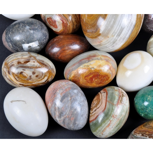 35 - A large collection of approx; 90 mineral, clay and carved wooden eggs. Multiple marble egg examples ... 