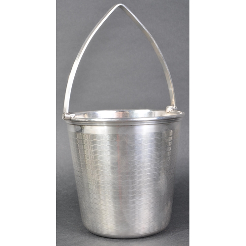 56 - An early 20th Century Art Deco silver plated ice bucket of tapering cylindrical form having engine t... 