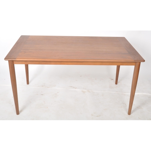 A contemporary retro style walnut dining table of rectangular form