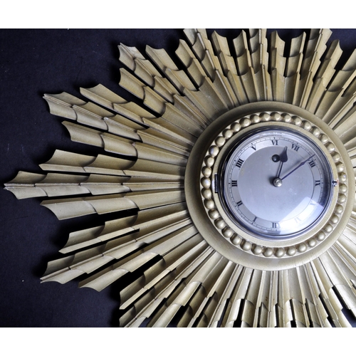 9 - Smith - An art deco 1930's Smiths sunburst gesso gilt wall clock. The clock design like a sun / flam... 