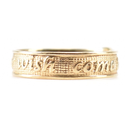 A hallmarked 9ct gold band ring. The ring having an etched texture ...