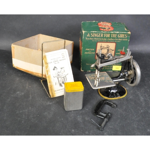An early 20th century circa 1920s miniature Singer sewing machine No
