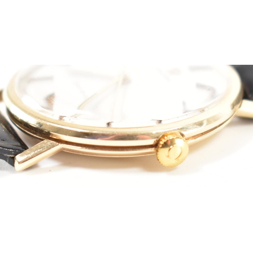 200 - An Omega Geneve 9ct gold wrist watch. The watch having a round face with a brushed dial having baton... 