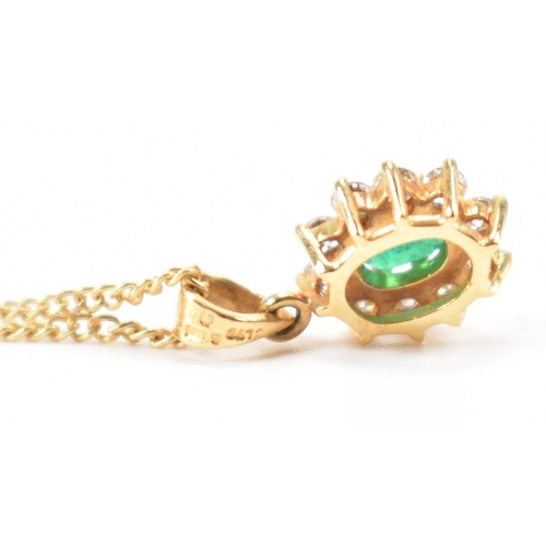 205 - A hallmarked 18ct gold emerald and diamond cluster pendant necklace.  Weight 3.2g. Estimated diamond... 