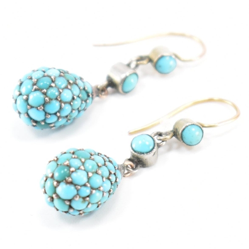 206 - A pair of 19th Century Victorian turquoise drop earrings. The earrings each being bezel set with two... 