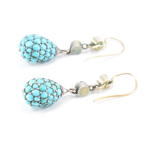 206 - A pair of 19th Century Victorian turquoise drop earrings. The earrings each being bezel set with two... 