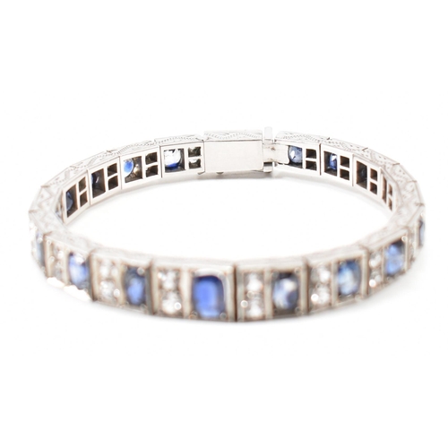 210 - An Art deco white metal sapphire and white stone bracelet. The bracelet constructed from hinged pane... 