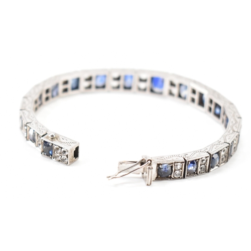 210 - An Art deco white metal sapphire and white stone bracelet. The bracelet constructed from hinged pane... 