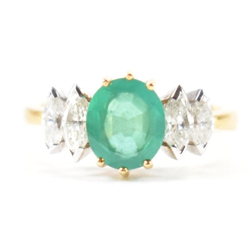 212 - A hallmarked 18ct gold synthetic emerald & diamond ring. The ring set with a central oval synthetic ... 