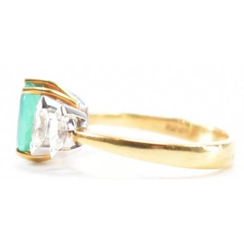 212 - A hallmarked 18ct gold synthetic emerald & diamond ring. The ring set with a central oval synthetic ... 