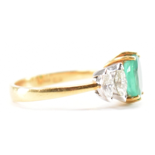 212 - A hallmarked 18ct gold synthetic emerald & diamond ring. The ring set with a central oval synthetic ... 