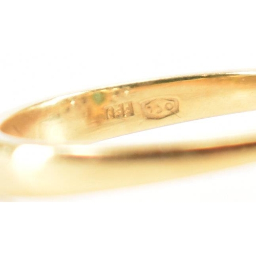 212 - A hallmarked 18ct gold synthetic emerald & diamond ring. The ring set with a central oval synthetic ... 