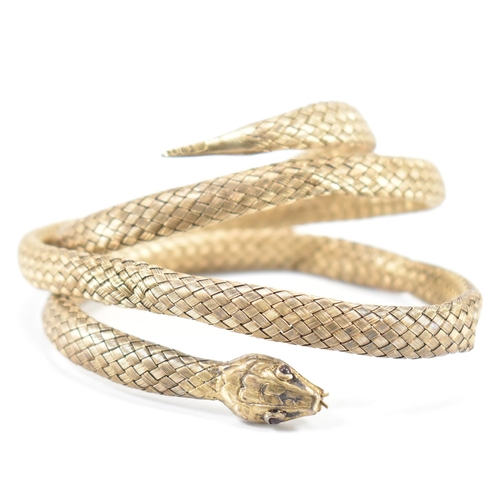 220 - A 19th Century Victorian Russian silver gilt snake bangle. The bangle made from woven gilt silver wi... 