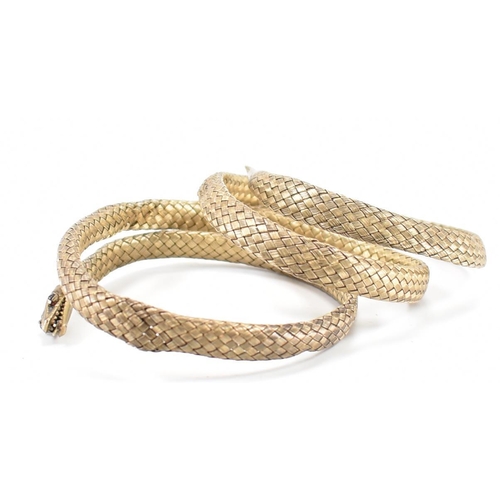 220 - A 19th Century Victorian Russian silver gilt snake bangle. The bangle made from woven gilt silver wi... 