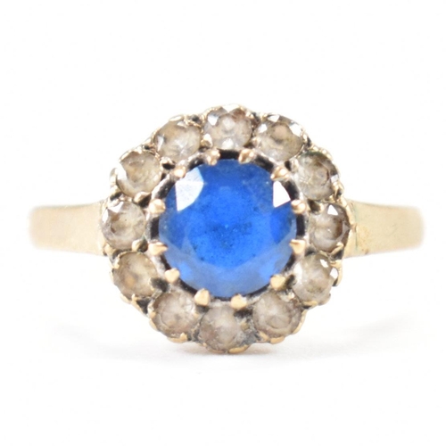 223 - A hallmarked 9ct gold blue and white stone ring. The ring being set with a round cut blue stone with... 