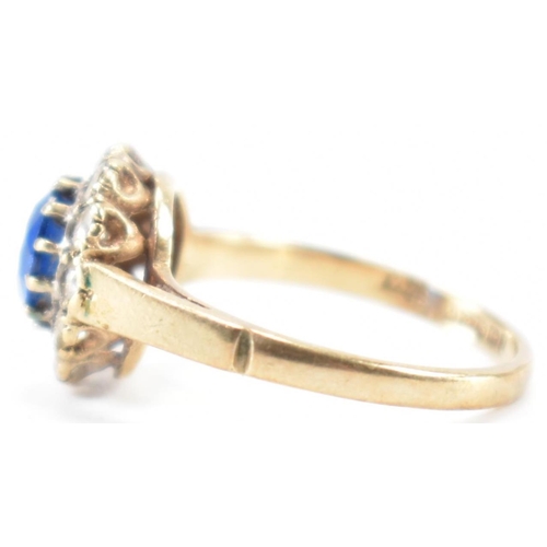 223 - A hallmarked 9ct gold blue and white stone ring. The ring being set with a round cut blue stone with... 