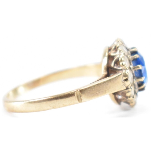 223 - A hallmarked 9ct gold blue and white stone ring. The ring being set with a round cut blue stone with... 