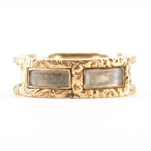 230 - A 19th Century Victorian hallmarked 18ct gold and enamel mourning ring. The ring having engraved flo... 