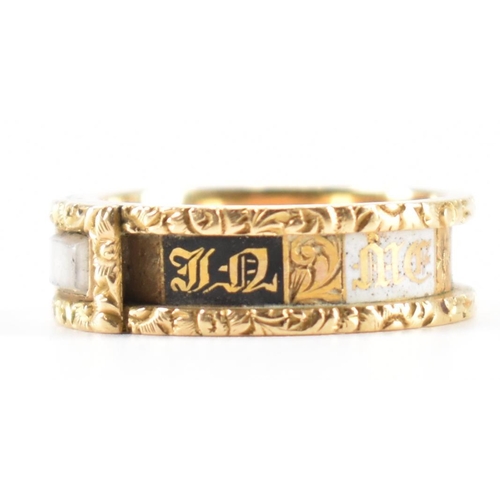 230 - A 19th Century Victorian hallmarked 18ct gold and enamel mourning ring. The ring having engraved flo... 