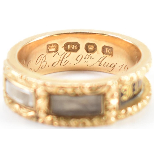 230 - A 19th Century Victorian hallmarked 18ct gold and enamel mourning ring. The ring having engraved flo... 