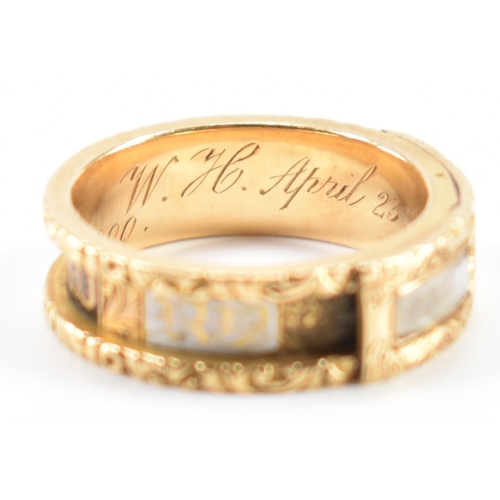 230 - A 19th Century Victorian hallmarked 18ct gold and enamel mourning ring. The ring having engraved flo... 