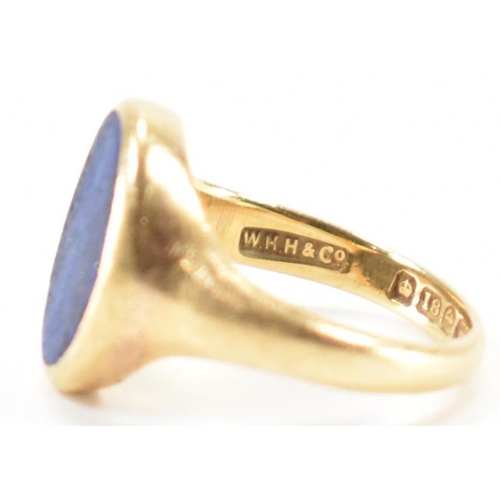 233 - A hallmarked 18ct gold signet ring having oval lapis lazuli panel to centre set within a bezel mount... 