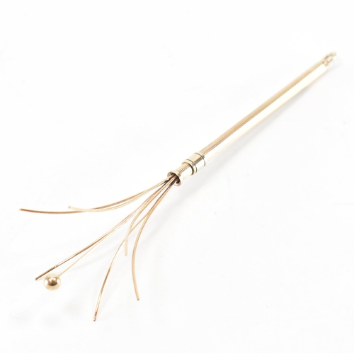 237 - A vintage 1960s hallmarked 9ct gold cocktail swizzle stick. The stick having engine turned detailing... 