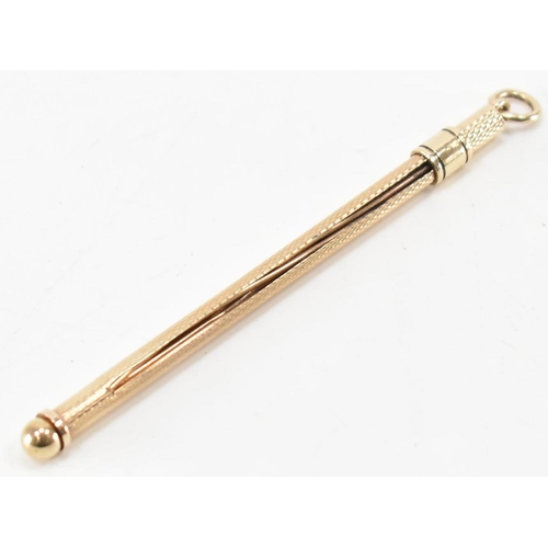 237 - A vintage 1960s hallmarked 9ct gold cocktail swizzle stick. The stick having engine turned detailing... 