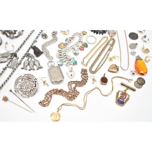 239 - An assortment of Victorian and later costume jewellery. The lot to include a Victorian mourning broo... 