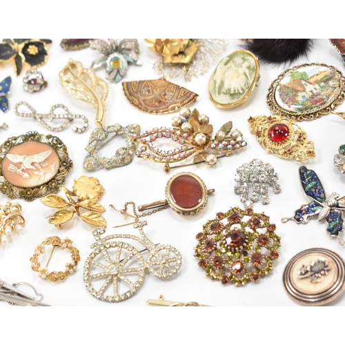 240A - A collection of vintage brooches. The lot to include cameo brooch, mid century brooches, enamelled o... 