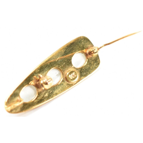 240 - A gold and moonstone pendant brooch. The brooch of brushed triangular form set with three oval moons... 