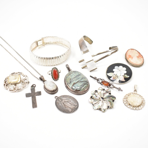 243 - A collection of silver jewellery. The lot to include a moonstone pendant necklace (marked 925), text... 