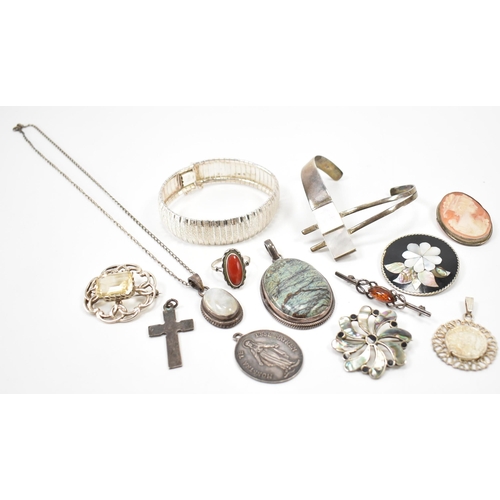 243 - A collection of silver jewellery. The lot to include a moonstone pendant necklace (marked 925), text... 