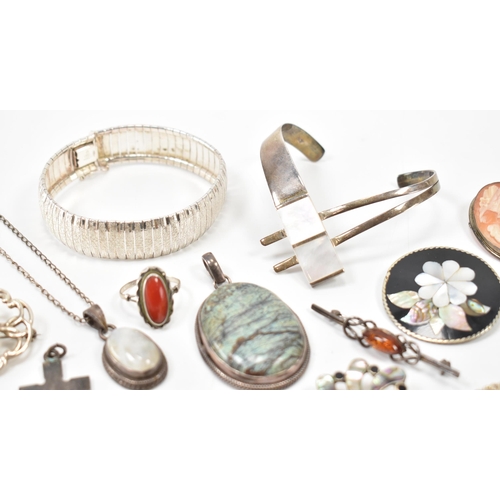 243 - A collection of silver jewellery. The lot to include a moonstone pendant necklace (marked 925), text... 