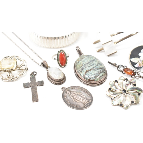 243 - A collection of silver jewellery. The lot to include a moonstone pendant necklace (marked 925), text... 