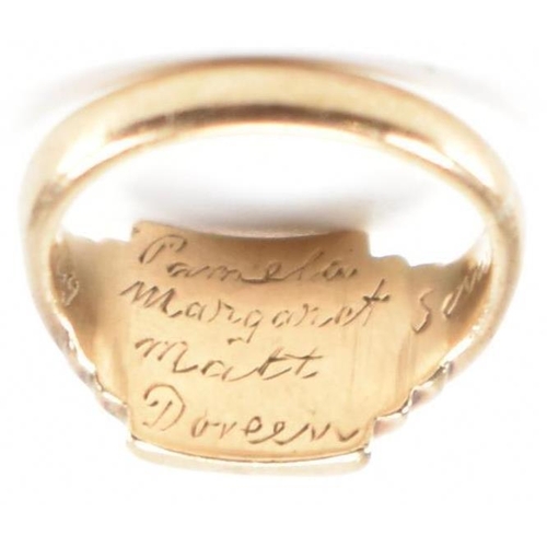 245 - A hallmarked 9ct gold children's signet ring. The ring having engraved initials to square head with ... 