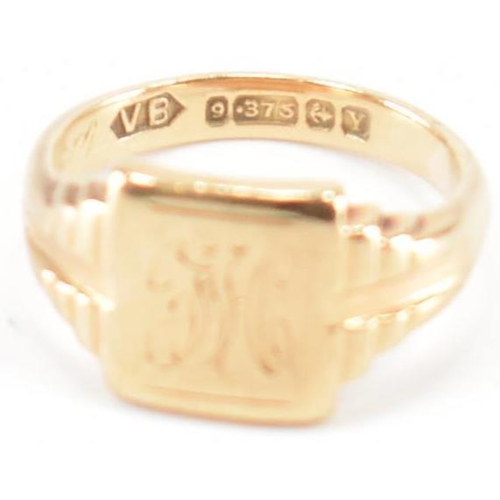 245 - A hallmarked 9ct gold children's signet ring. The ring having engraved initials to square head with ... 