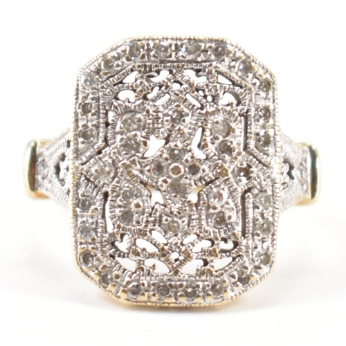 248 - A vintage gold and diamond panel ring. The ring having a canted rectangular panel to the head set th... 