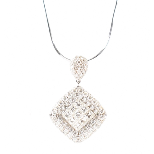 250A - A hallmarked 18ct white gold and diamond pendant necklace. The necklace having a fine snake chain wi... 